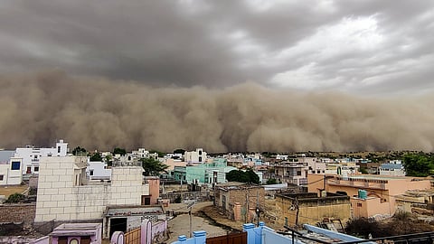 A huge dust storm approaches as it engulfs the skyline at Dungargarh,