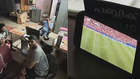 Football fans in Kerala's Kanjoor protest power cut by watching WC game in KSEB office .