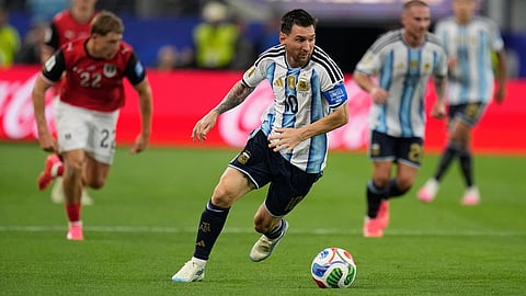 Argentina's Lionel Messi (10) controls the ball during the World Cup Group J soccer match between Argentina and Austria 