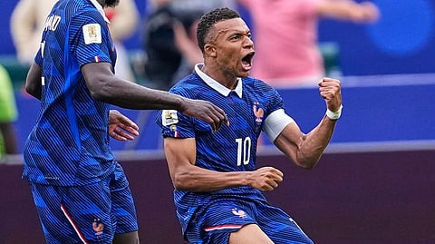France's Kylian Mbappe (10) celebrates after scoring his team's first goal during the World Cup Group I soccer match between France and Iraq in Philadelphia 
