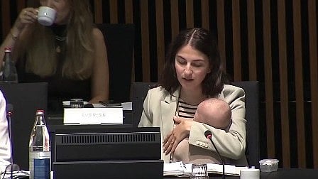 Swedish climate minister at EU meeting with three-month-old baby