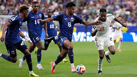 Cape Verde's Kevin Pina (6) dribbles the ball against Saudi Arabia's Mohamed Kanno (23) during the World Cup Group H soccer match between Cape Verde and Saudi Arabia  