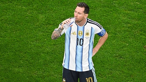 Argentina's Lionel Messi drinks water during a hydration break of the World Cup Group J soccer match between Argentina and Austria 