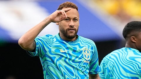 Brazil's Neymar (10) waves to the fans  