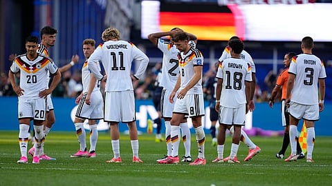 Germany players are dejected at the end of the World Cup round of 32 soccer match between Germany and Paraguay  