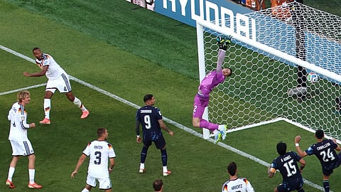 Paraguay goalkeeper Orlando Gill (12) fails to save a goal that was disallowed by Germany's Jonathan Tah 