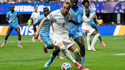 England's Harry Kane (9) and Congo's Axel Tuanzebe battle for the ball during the World Cup round of 32 soccer match 