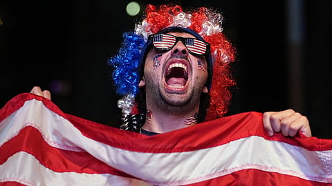 A U.S. soccer fan celebrates after the United States defeated Bosnia in their World Cup round of 32 soccer match