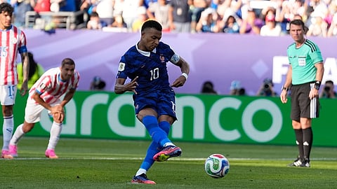 France's Kylian Mbappe scores from the penalty spot the opening goal during the World Cup round of 16 soccer match between Paraguay and France