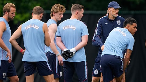 England head coach Thomas Tuchel talks to his team during training for the World Cup soccer tournament 