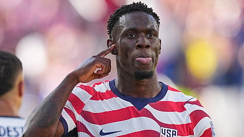 United States' Folarin Balogun (20) reacts after scoring his team's first goal during the World Cup round of 32 soccer match between the United States and Bosnia