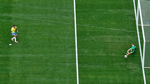 Norway goalkeeper Oerjan Nyland (1) saves a penalty from Brazil's Bruno Guimaraes (8) during the World Cup round of 16 soccer match between Brazil and Norway 