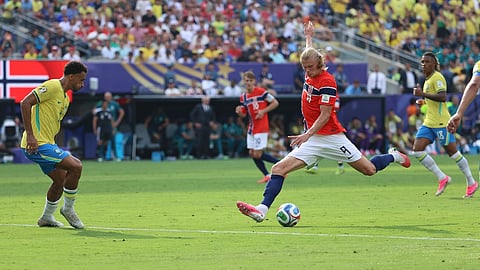 Norway's Erling Haaland (9) shoots and scores their second goal during the World Cup round of 16 soccer match between Brazil and Norway 