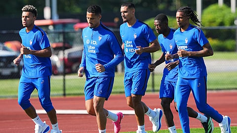 France's Desire Doue, France's William Saliba, France's Maxence Lacroix, France's Ousmane Dembele and France's Michael Olise exercise during a training session 