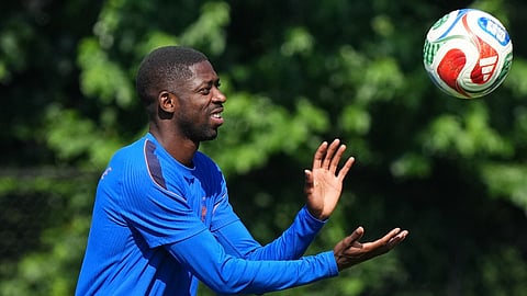 France's Ousmane Dembele (7) exercises during a training session ahead of the World Cup quarterfinal soccer match between France and Morocco 