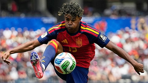 Spain's Lamine Yamal (19) controls the ball during the World Cup quarterfinal soccer match between Spain and Belgium  