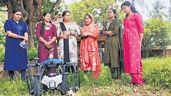 Women from Kasaragod Kudumbashree unit with the drone 