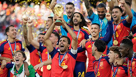 Spain's Rodri celebrates with the trophy after winning the World Cup final soccer match between Spain and Argentina 