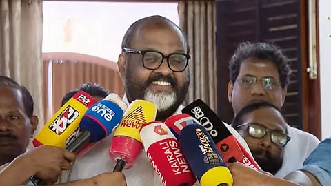 Minister C P John