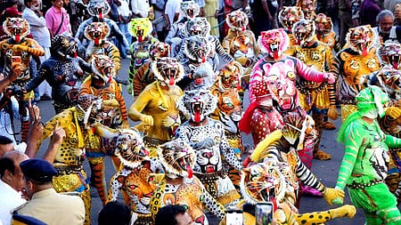 Swaraj Round comes alive with Pulikali performers in colourful tiger costumes as the traditional folk art adds a vibrant festive spirit to the Onam celebrations in Thrissur. 