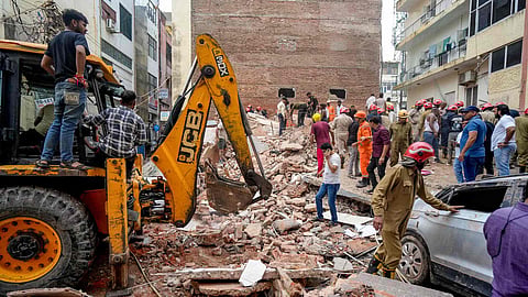 Rescue operation underway after a building collapsed at Satya Niketan area, in New Delhi