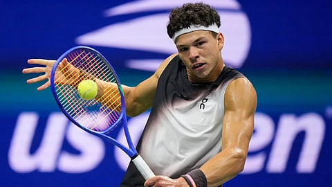 Ben Shelton, of the United States, returns the ball to Frances Tiafoe, of the United States, during the men's singles semifinals of the U.S. Open tennis championships 