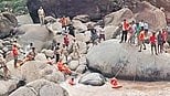 Officials carrying out rescue operations at Kodenchery on Tuesday