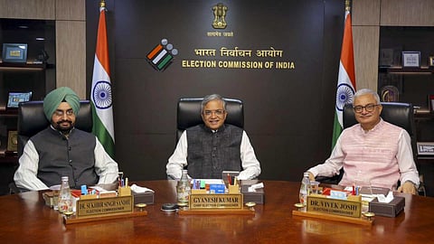 Chief Election Commissioner Gyanesh Kumar is flanked by Election Commissioners Sukhbir Singh Sandhu (left) and Vivek Joshi