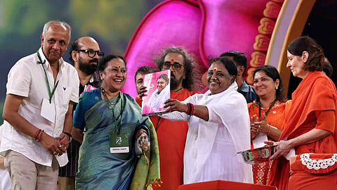 Mata Amritanandamayi Devi releasing 'Amma Speaks', a compilation of her articles published in The New Indian Express daily