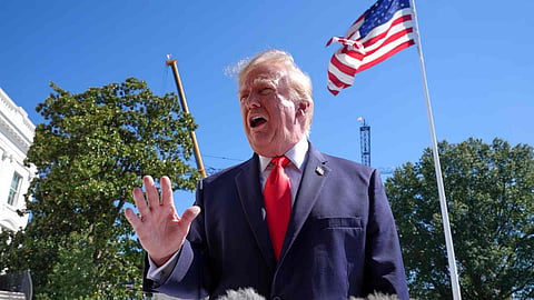 US President Donald Trump speaks with reporters before boarding Marine One on the South Lawn of the White House