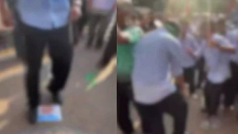 Prime Minister's picture placed on the ground and trampled upon; police case registered against ten students.