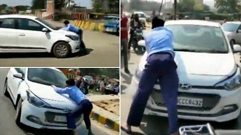 വാഹനമിടിച്ചത് ചോദ്യം ചെയ്തു ; ആളെ ബോണറ്റിൽ തൂക്കി രണ്ട് കിലോമീറ്ററോളം കാർ ഓടിച്ചു ; 23 കാരൻ അറസ്റ്റിൽ (വീഡിയോ)