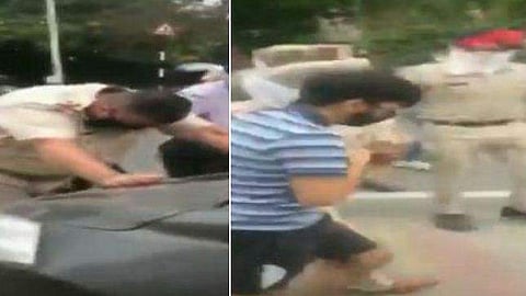പരിശോധനക്കായി കൈ കാണിച്ചു; പൊലീസ് ഓഫീസറെ ബോണറ്റില്‍ ഇരുത്തി അതിവേഗത്തില്‍ കാറോടിച്ച് ഡ്രൈവറുടെ പരാക്രമം (വീഡിയോ)
