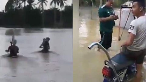 കഴുത്തോളം വെളളം, ഹാന്‍ഡിലും മറഞ്ഞ് ഒഴുക്ക്; വെളളപ്പൊക്കത്തിലൂടെ ബൈക്ക് ഓടിച്ച് യുവാക്കള്‍, അതിസാഹസികത (വീഡിയോ)