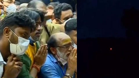 പൊന്നമ്പലമേട്ടിലെ മകരവിളക്ക് ദര്‍ശിക്കുന്ന ഭക്തര്‍/ ടെലിവിഷന്‍ ചിത്രം