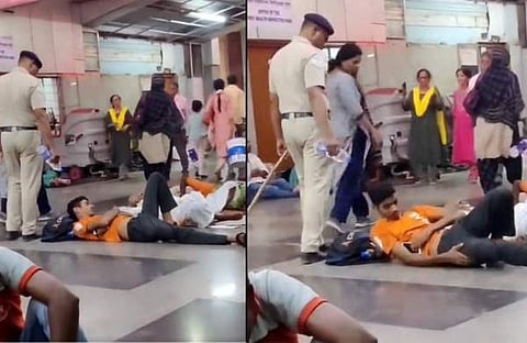 യാത്രക്കാരുടെ മുഖത്ത് വെള്ളമൊഴിച്ച് പൊലീസുകാരൻ/ ട്വിറ്റർ