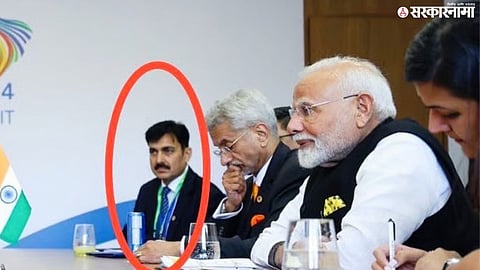 Prime Minister Narendra Modi with PMO officer Hiten Joshi during an official engagement.