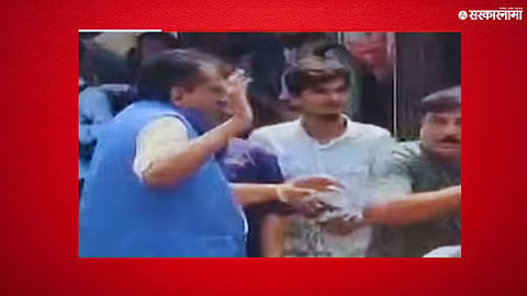 A woman confronts and hits a corporator associated with Eknath Shinde, triggering political reactions and viral attention.

