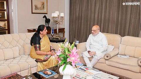 Union Home Minister Amit Shah and Sunetra Pawar during a key political meeting that has triggered discussions over the Maharashtra cabinet expansion.