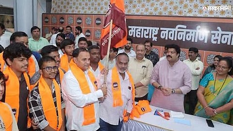 MNS leader Raju Patil welcomes BJP workers into the Maharashtra Navnirman Sena during a party induction programme.