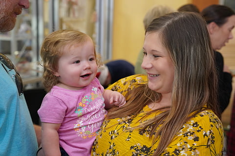 Monica with one of her daughters 