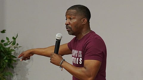 Kevin Hunt of the Lessons Learned program speaks to youth attending the summit