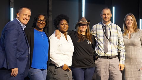 Left to Right: Little Rock Police Chief Heath Helton, 100 Families Initiative Family Advocate LaShanna Bruce, Johnisha Graham with the Little Rock Police Department, Heather Mahan of MEMS emergency vehicles, Sgt. Douglas Bjork of the Pulaski County Sheriff's Office, and 100 Families Initiative Family Advocate Deanna Walderns