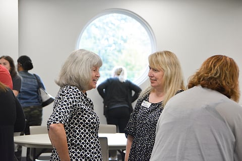 Sarah Steifel of the White County Literacy Council networking with community member.