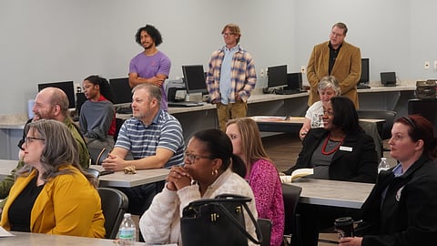 Community members listen as specialists discuss the importance of participant and provider interactions.