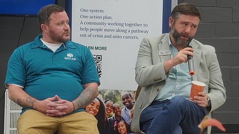 Justin Buck of Wolfe Street (right) tells a story about working in the recovery field. On the left is Justin Welborn of Serenity Park.  