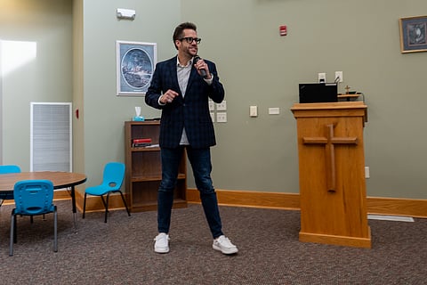Kevin Brown speaks about the benefits of communities coming together during a collective impact meeting in Milford.