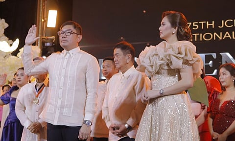 2024 National President of JCI Philippines, Atty. Mark Peter M. Quilaneta takes his  oath of office as his wife, Charinna Barro-Quilaneta, 2024 President of JCI Lakambini  Davao, looks on.