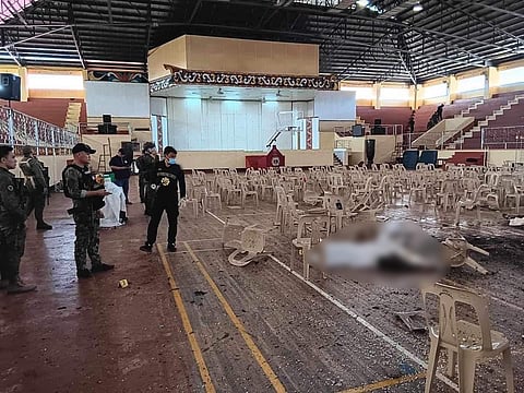 In this handout photo provided by the Provincial Government of Lanao del Sur-Public Information Office, law enforcers conduct an investigation at the site of an explosion in Marawi City on Sunday Dec. 3, 2023. A powerful explosion believed caused by a bomb ripped through a Catholic mass and killed several people and wounded dozens in a predominantly Muslim city in the southern Philippines, officials said.