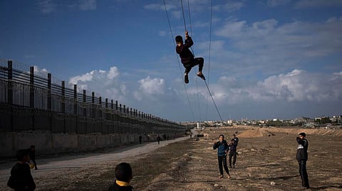 PALESTINIANS displaced by Israeli bombardment of northern Gaza Strip play next to the border with Egypt, in Rafah, southern Gaza on Sunday, Jan. 14, 2024. / AP 
